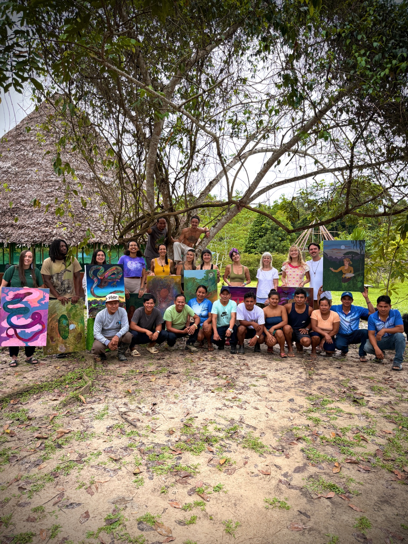 Residency group gathered with finished artworks outdoors