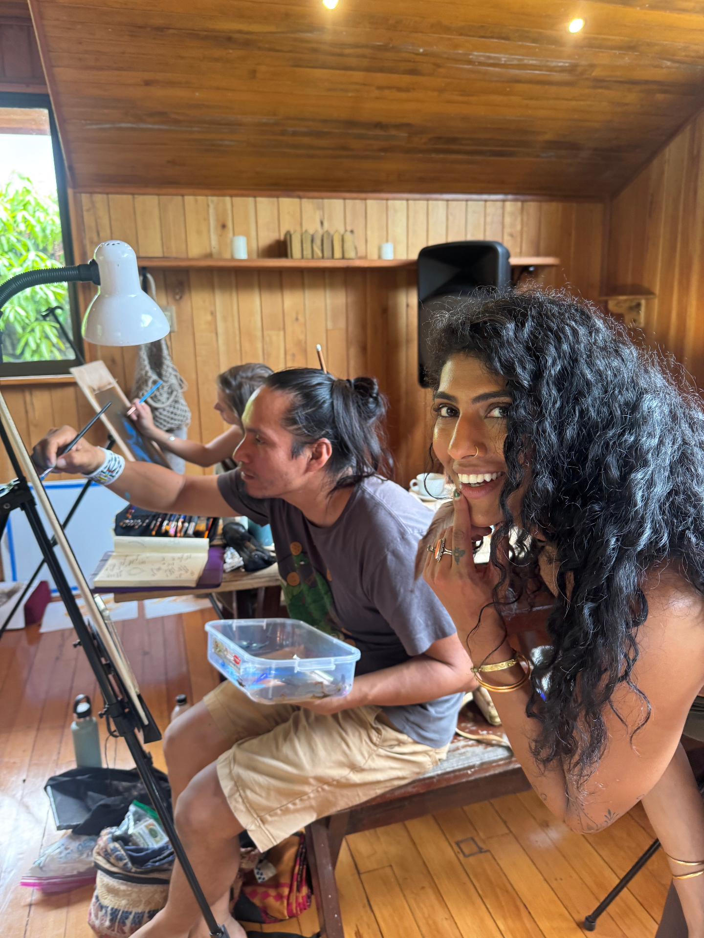 Studio moment with artist and guide during painting practice
